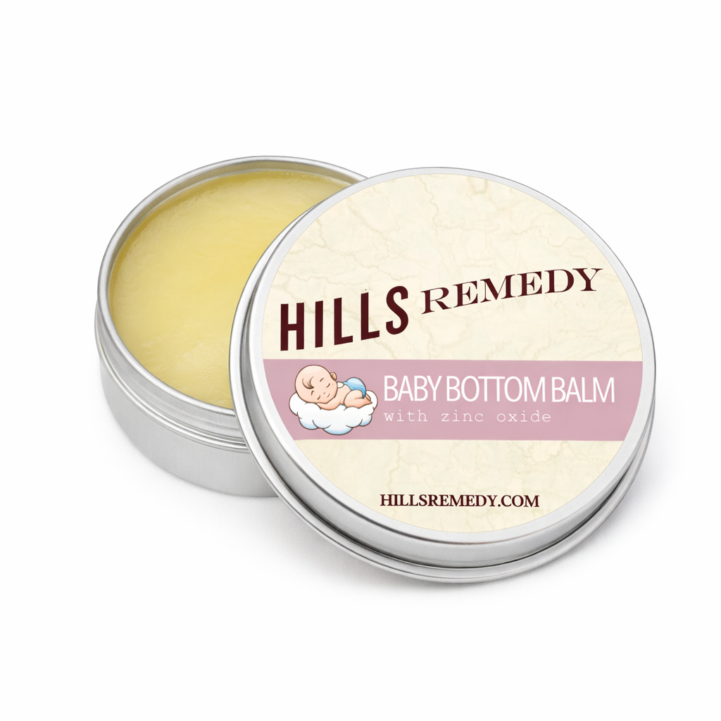 Hills Remedy Baby Bottom Balm in a metal tin on a white background