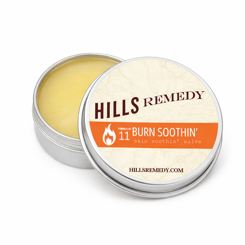 Hills Remedy burn soothing salve in a metal tin on a white background