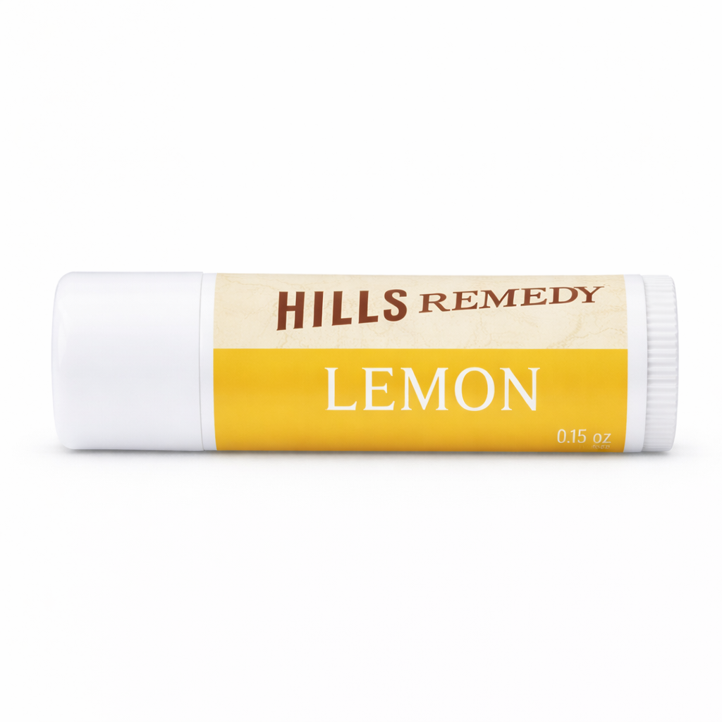 Lip balm with 'Hills Remedy Lemon' label on a white background
