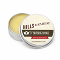 Hills Remedy nursing hands salve in a metal tin with a white background