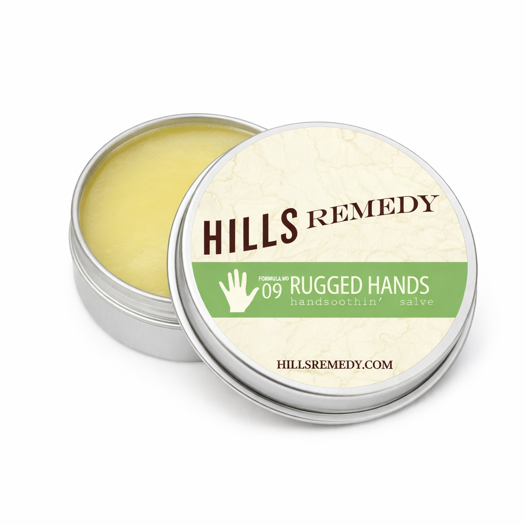 Hills Remedy hand salve tin with open lid on a white background