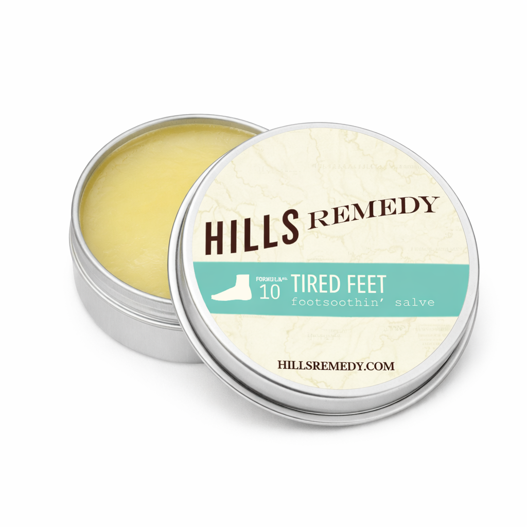 Hills Remedy foot balm in a metal tin with a white background
