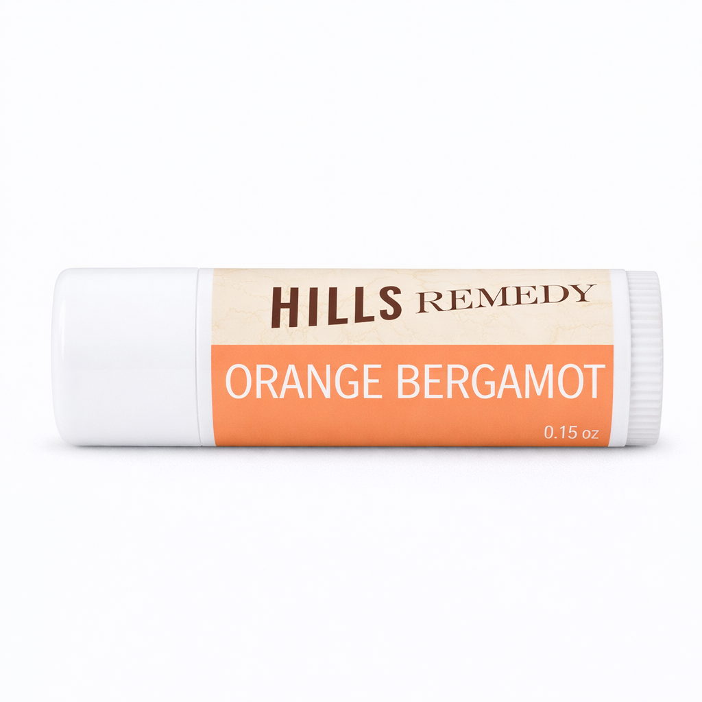 Balm stick with 'Hills Remedy' branding and 'Orange Bergamot' flavor on a white background