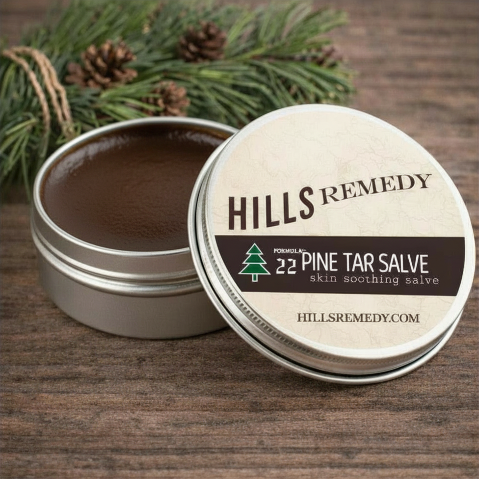 Hills Remedy pine tar salve with open lid on a wooden surface